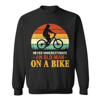 Never Underestimate Funny Quote An Old Man On A Bicycle Retr Sweatshirt - Seseable