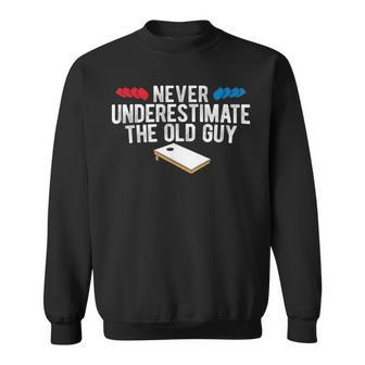 Never Underestimate The Old Guy Cornhole Gift For Mens Sweatshirt | Mazezy