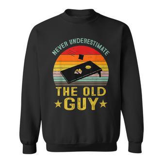 Never Underestimate The Old Guy Funny Cornhole Game Player Sweatshirt | Mazezy