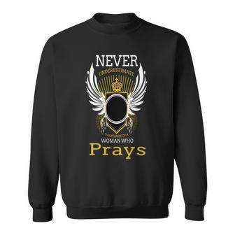 Never Underestimate The Power Of A Woman Who Prays Sweatshirt - Seseable