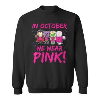 In October We Wear Pink Breast Cancer Awareness Halloween Sweatshirt - Monsterry AU