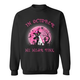 In October We Wear Pink Cat Witch Breast Cancer Halloween Sweatshirt - Monsterry
