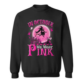 In October We Wear Pink Ribbon Witch Halloween Breast Cancer Sweatshirt - Monsterry