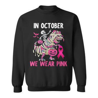 In October We Wear Pink T Rex Dino Halloween Breast Cancer Sweatshirt - Thegiftio UK
