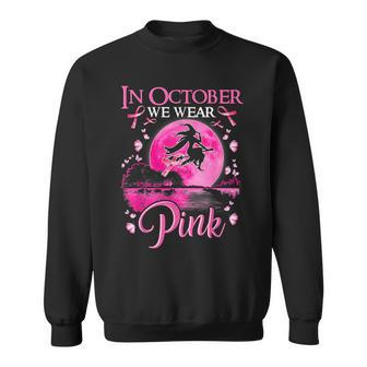 In October We Wear Pink Witch Ribbon Breast Cancer Halloween Sweatshirt - Monsterry AU