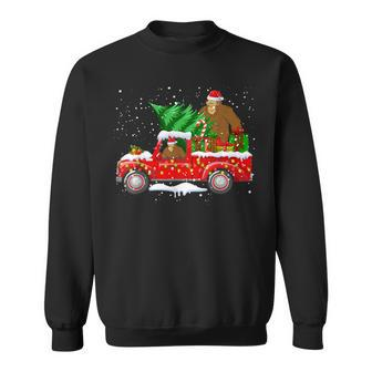 Santa Bigfoot Riding Red Truck & Xmas Tree Merry Christmas Sweatshirt - Thegiftio UK