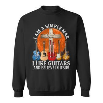I Am A Simple Man I Like Guitars And Believe In Jesus Sweatshirt | Mazezy