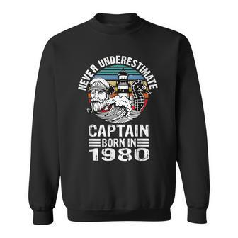 Never Underestimate Captain Born In 1980 Captain Sailing Sweatshirt | Mazezy
