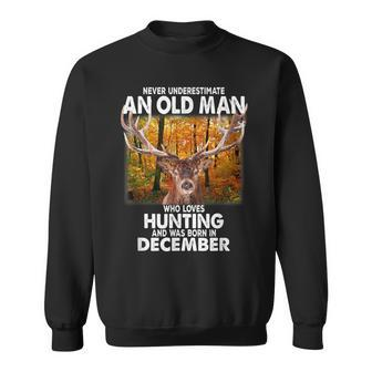 Never Underestimate A Man Loves Hunting Born In December Sweatshirt - Seseable