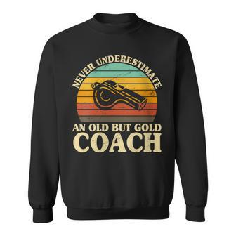 Never Underestimate An Old Coach Baseball Basketball Trainer Sweatshirt - Monsterry DE