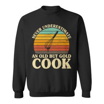 Never Underestimate An Old Cook Chef Coat Cooking Sweatshirt - Monsterry