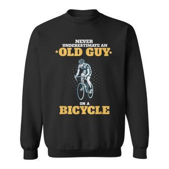 Never Underestimate An Old Guy On A Bicycle Cycling Sweatshirt - Seseable