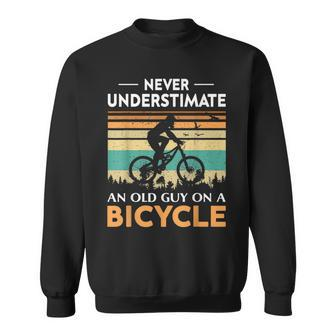 Never Underestimate An Old Guy On A Bicycle Cycling Vintage Sweatshirt - Seseable