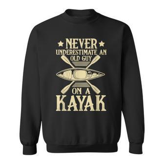 Never Underestimate An Old Guy On A Kayak Sweatshirt - Monsterry