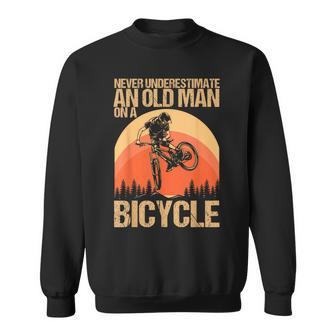 Never Underestimate An Old Man On A Bicycle Cycling Sweatshirt - Monsterry UK