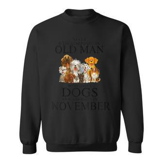 Never Underestimate An Old Man Who Loves Dogs In November Sweatshirt - Seseable