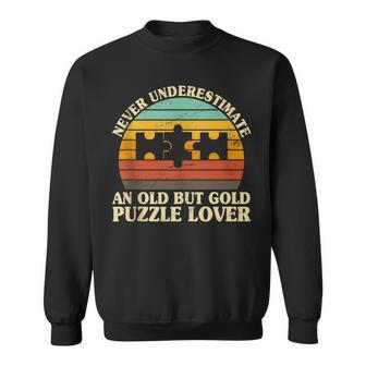 Never Underestimate An Old Puzzle Lover Jigsaw Enthusiast Sweatshirt - Monsterry DE