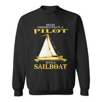Never Underestimate Sailboat Pilot Sweatshirt - Seseable