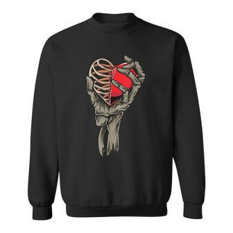 Valentines Day Skull Skeleton Hand Holding Red Heart Love Sweatshirt - Seseable