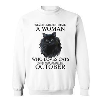 Never Underestimate A Woman Who Loves Cats Born In October Sweatshirt - Seseable