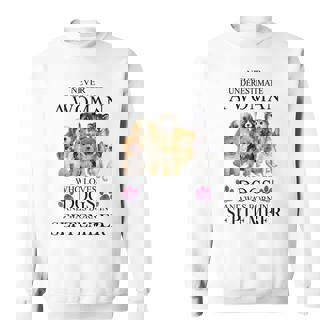 Never Underestimate A Woman Who Loves Dog Born In September Sweatshirt | Mazezy