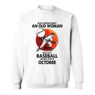 Never Underestimate An Old Woman Love Baseball October Old Woman Funny Gifts Sweatshirt | Mazezy