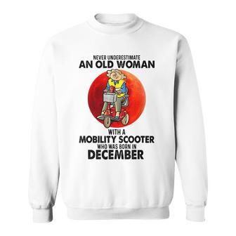 Never Underestimate An Old Woman Mobility Scooter December Sweatshirt - Seseable
