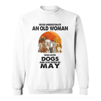 Never Underestimate An Old Woman Who Loves Dogs Born In May Sweatshirt - Seseable