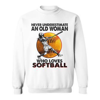 Never Underestimate An Old Woman Who Loves Softball Gift Sweatshirt - Seseable
