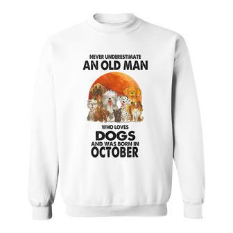 Never Underestimate An Old Man Who Loves Dogs Born October Sweatshirt | Mazezy
