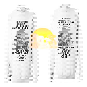 Never Underestimate An Old March Lady Who Loves Dogs Pet Sweatshirt - Seseable