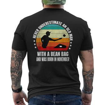 Never Underestimate An Old Man With A Bean Bag November Men's T-shirt Back Print - Monsterry DE