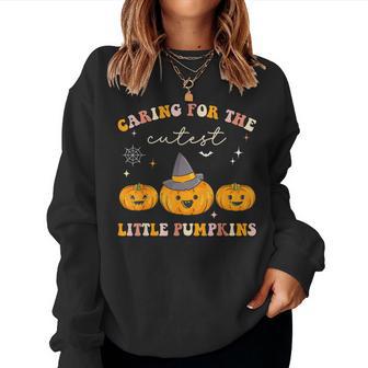 Caring For Cutest Little Pumpkins Pediatric Nurse Halloween Women Sweatshirt - Monsterry