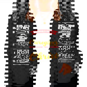 Christian Christ Never Underestimate A Caregiver Women Crewneck Graphic Sweatshirt - Seseable