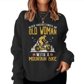 Never Underestimate An Old Woman With A Mountain Bike Women Sweatshirt - Thegiftio UK