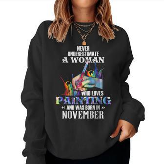 For November Guy Never Underestimate A Woman Who Loves Women Sweatshirt - Seseable