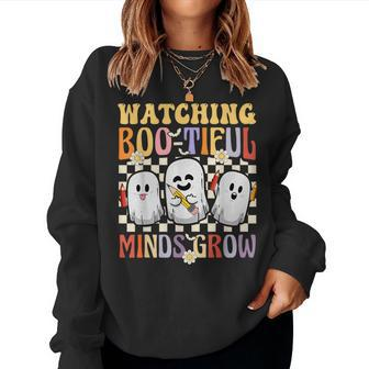 Halloween Teacher Retro Groovy Watching Boo-Tiful Minds Grow Women Sweatshirt | Mazezy