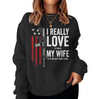 I Really Love It When My Wife Lets Me Buy More Guns Husband Women Crewneck Graphic Sweatshirt - Thegiftio UK