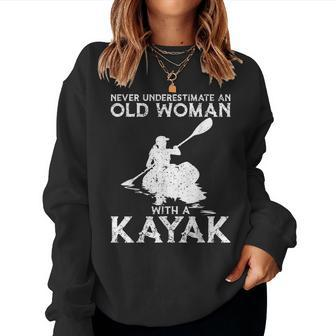 Kayaking Never Underestimate An Old Woman With A Kayak Women Sweatshirt - Monsterry