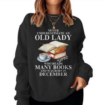Never Underestimate An Old December Lady Who Read Many Books Gift For Womens Women Crewneck Graphic Sweatshirt - Seseable