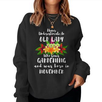 Never Underestimate An Old Lady Who Loves Gardening November Women Crewneck Graphic Sweatshirt - Seseable