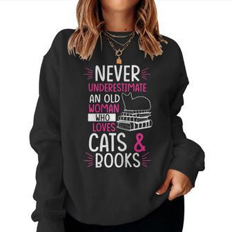 Never Underestimate An Old Woman Who Loves Cats & Books Gift Gift For Womens Women Crewneck Graphic Sweatshirt - Seseable