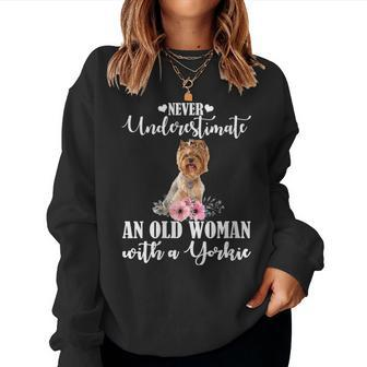 Never Underestimate An Old Woman With Yorkie Gift For Womens Women Crewneck Graphic Sweatshirt - Seseable