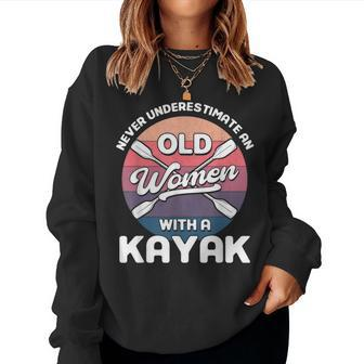 Never Underestimate An Old Women With A Kayak Kayaking Women Crewneck Graphic Sweatshirt - Seseable