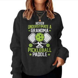Never Underestimate Grandma Pickleball Player Paddle Graphic Women Crewneck Graphic Sweatshirt - Seseable