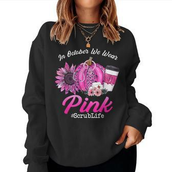 Nurse Scrub Life In October We Wear Pink Breast Cancer Fall Women Sweatshirt - Seseable