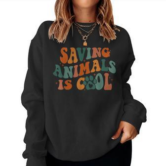 Retro Groovy Saving Animals Is Cool Veterinarian Vet Tech Women Sweatshirt - Monsterry DE