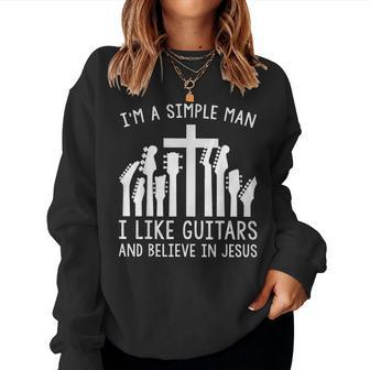Im A Simple Man I Like Guitars And Believe In Jesus Believe Women Sweatshirt | Mazezy