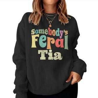 Somebodys Feral Tia Spanish Aunt Wild Family Groovy Auntie Women Sweatshirt | Mazezy