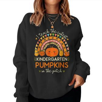 I Teach The Cutest Kindergarten Pumpkin Halloween Teacher Women Sweatshirt - Seseable